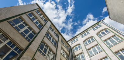 Clinker brick façade of a commercial building with a view of the sky