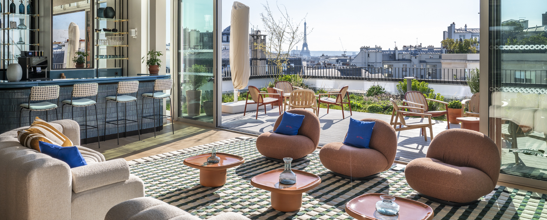 View from the lounge area to the roof terrace with a view of the Eiffel Tower